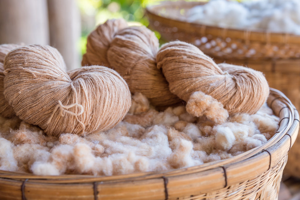 Natural wool balls in a basket. TerraKlay uses all natural materials in its production