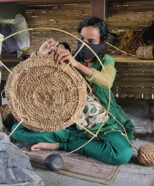 TerraKlay artisan hand weaving storage baskets made from recycled banana fibers to make functional home goods 