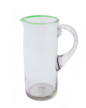 A clear glass pitcher with a green rim and handle, against a white background.