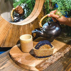 terraklay indogo coasters with a tumbler mug and a teapot.